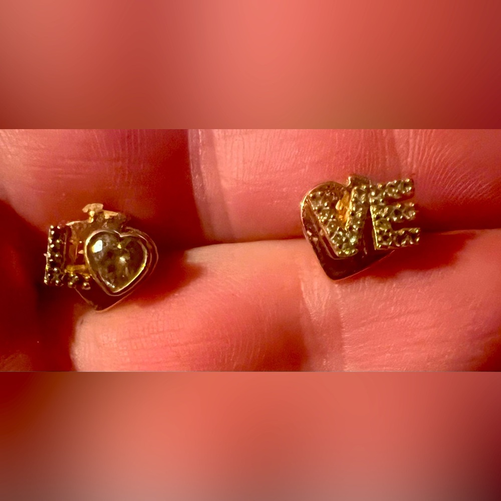 Kate spade stud earrings that say love. Rose gold and diamond.
